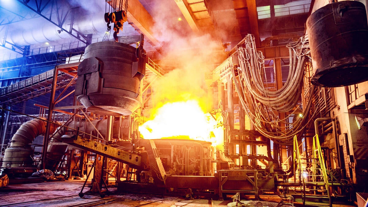 Scrap metal being poured into an electric arc furnace