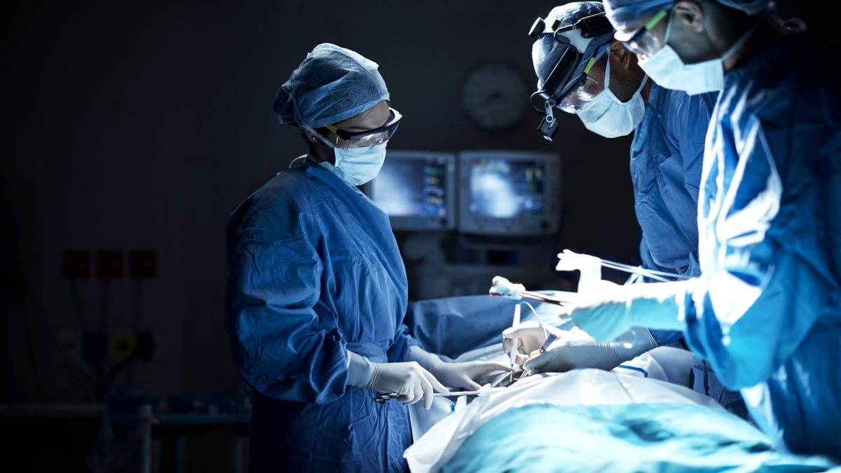 surgeons operating on person