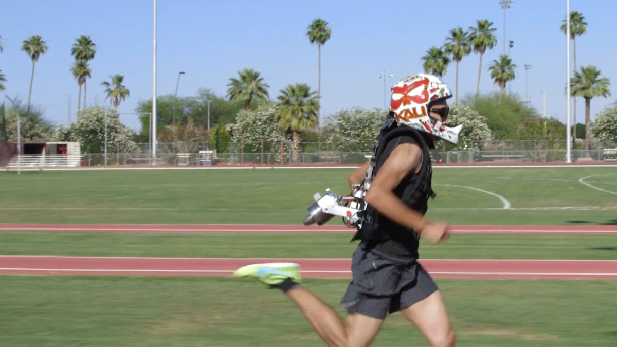 man running with jet pack on