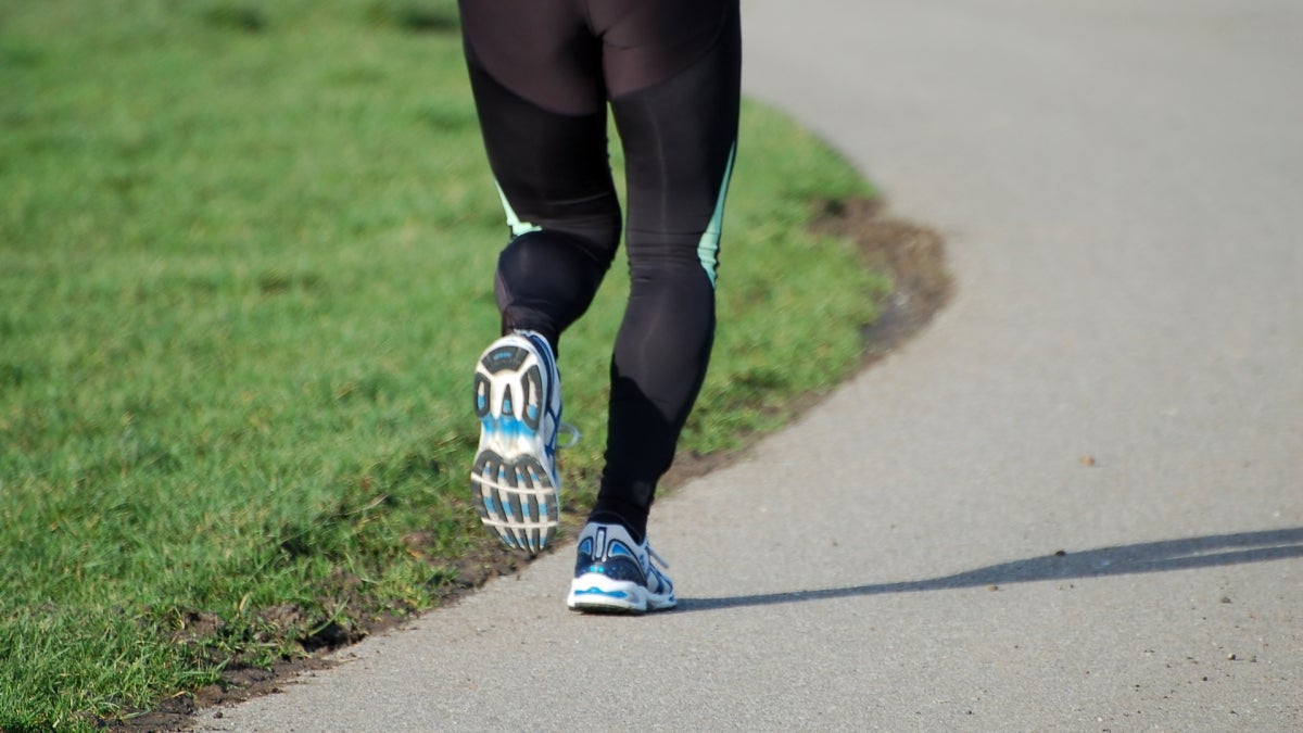 A man&#039;s legs shown jogging