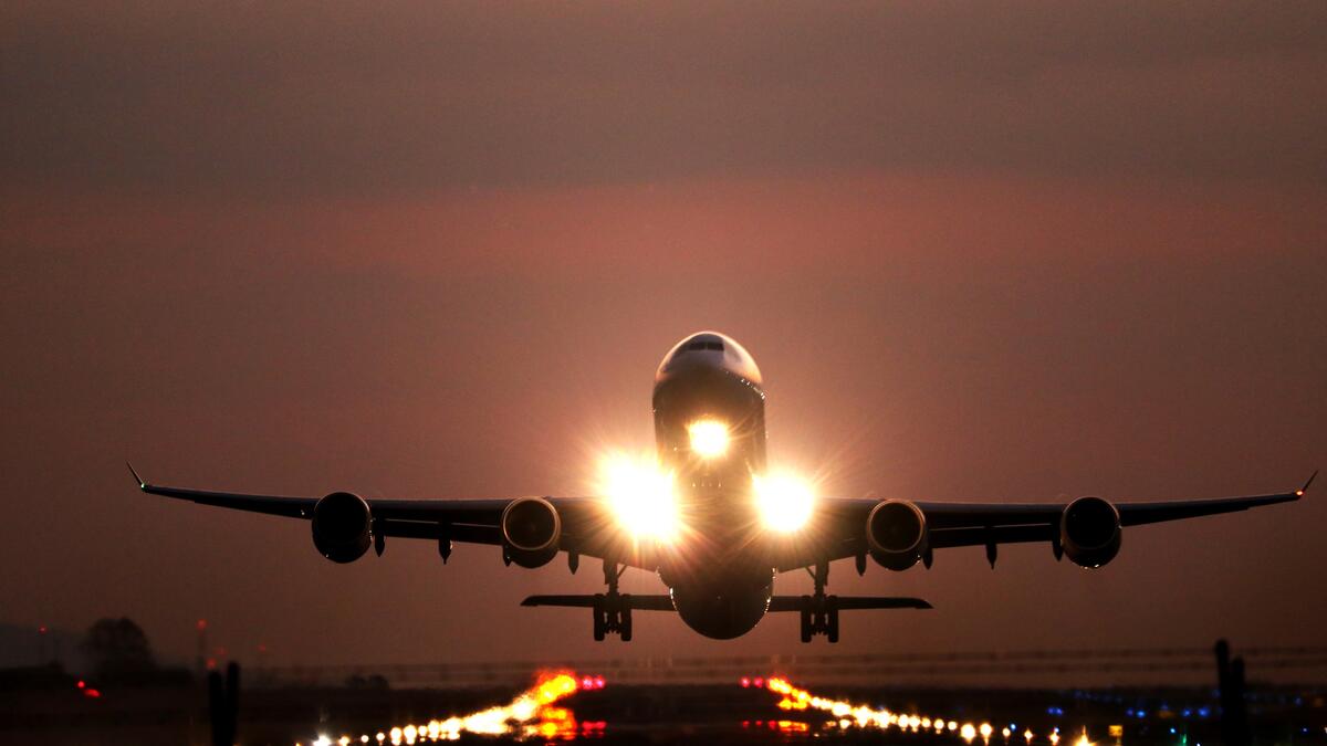 An airplane lifting off on the tarmac of an airport in Costa Rica