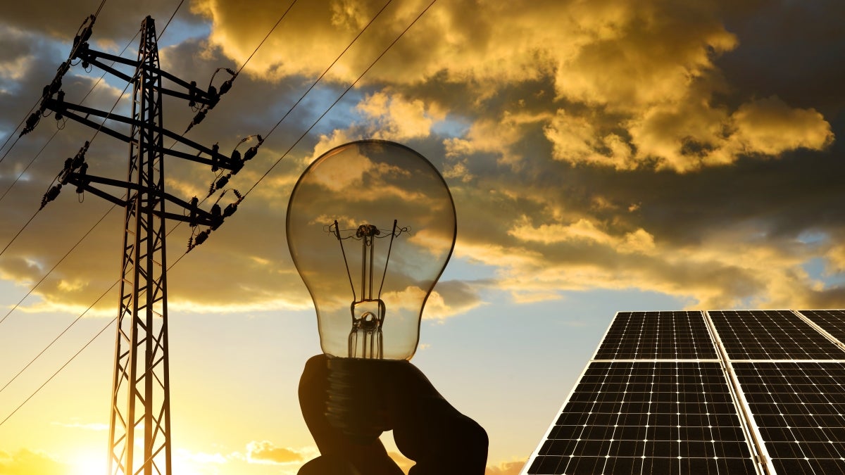 power pole, light bulb and solar panels