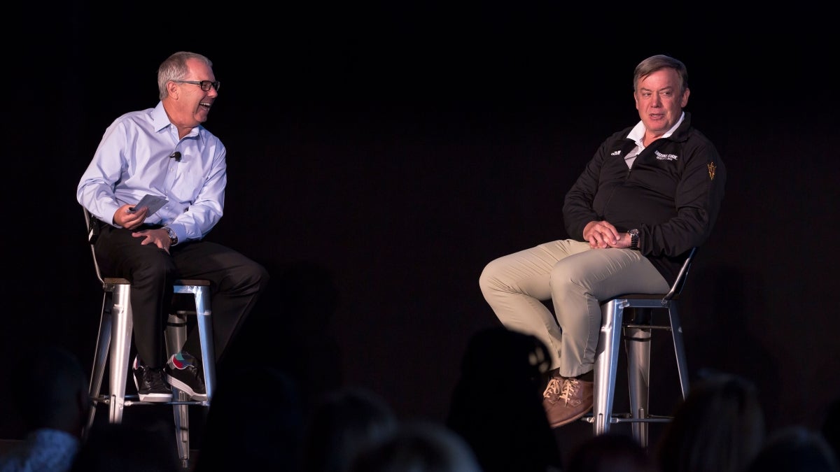 Mark King and Michael Crow speak onstage