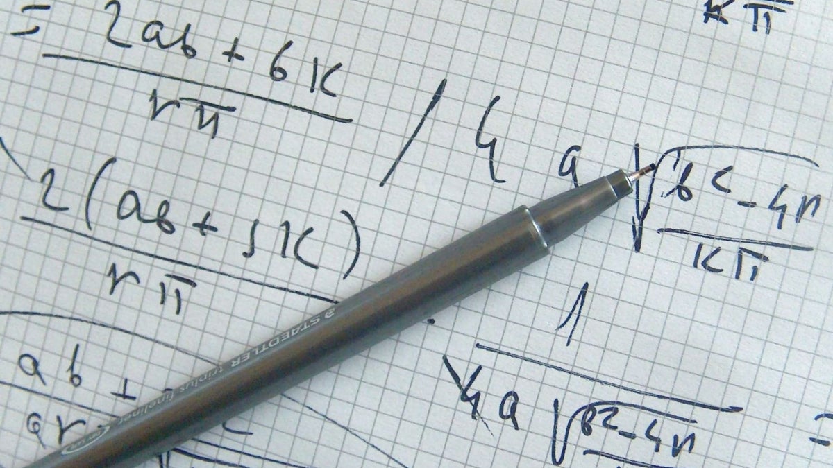 Equations on a sheet of paper.