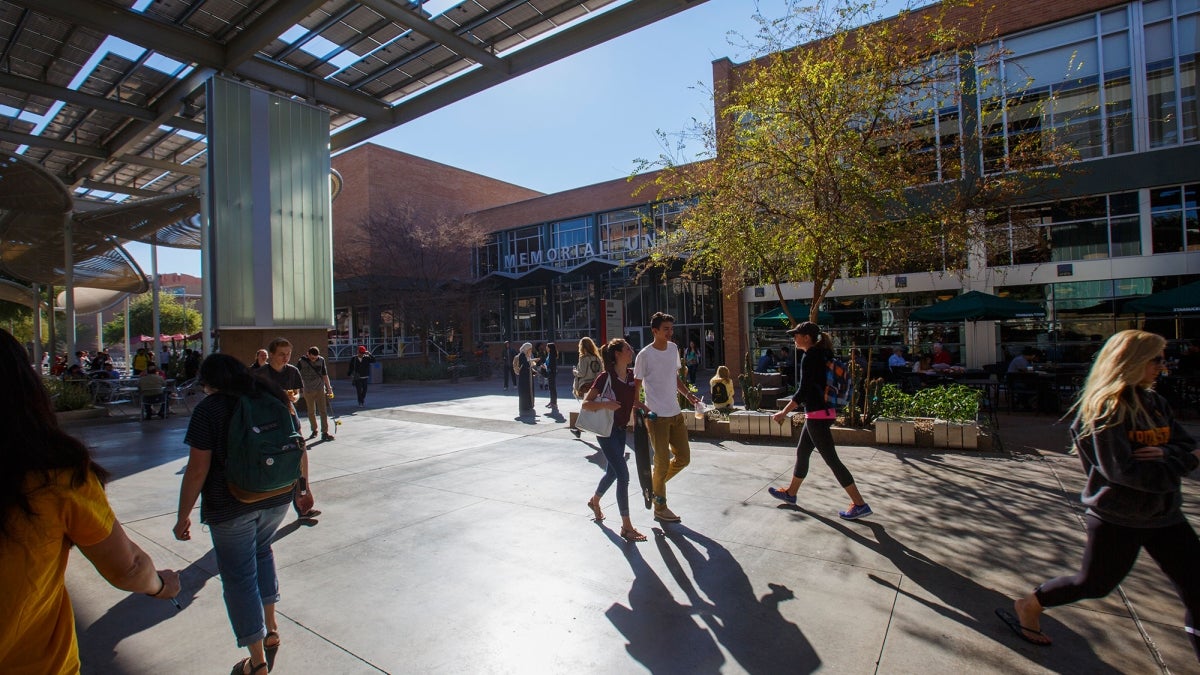 Students walk outside the ASU Memorial Union in Tempe