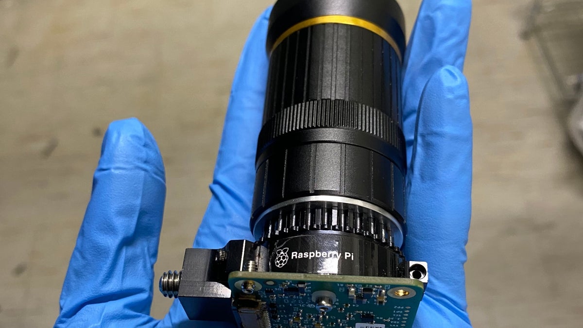 A hand holds a polarimetric imaging camera