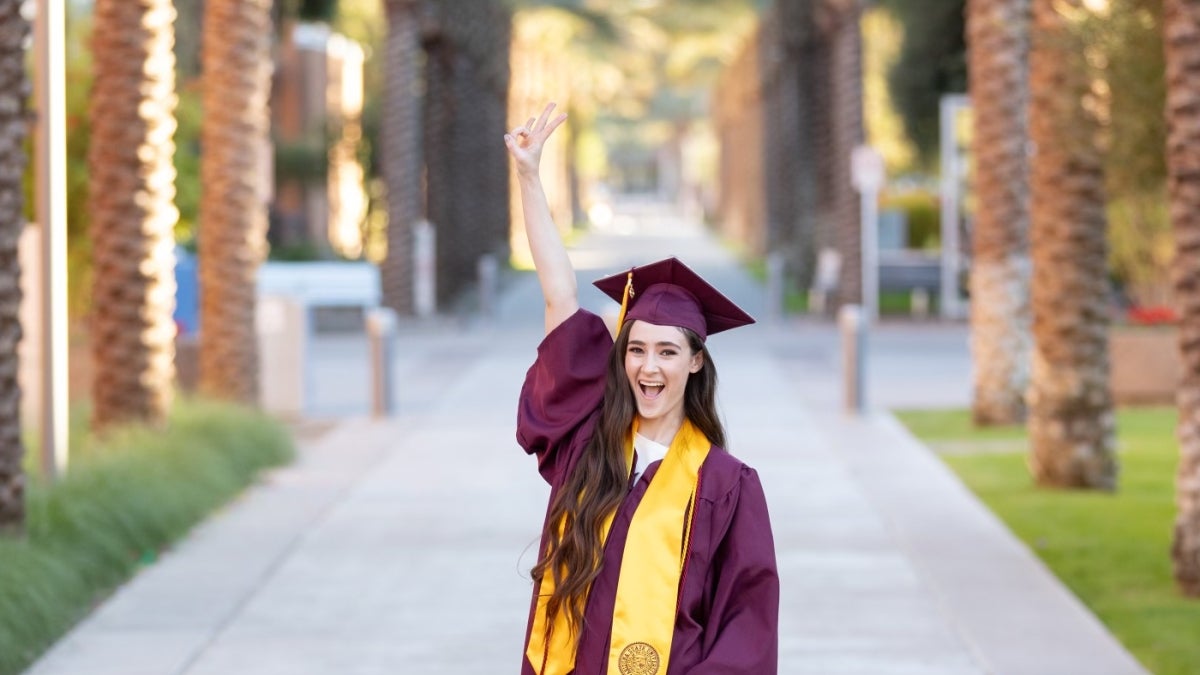 Nicole Waldmann stands along Palm Walk