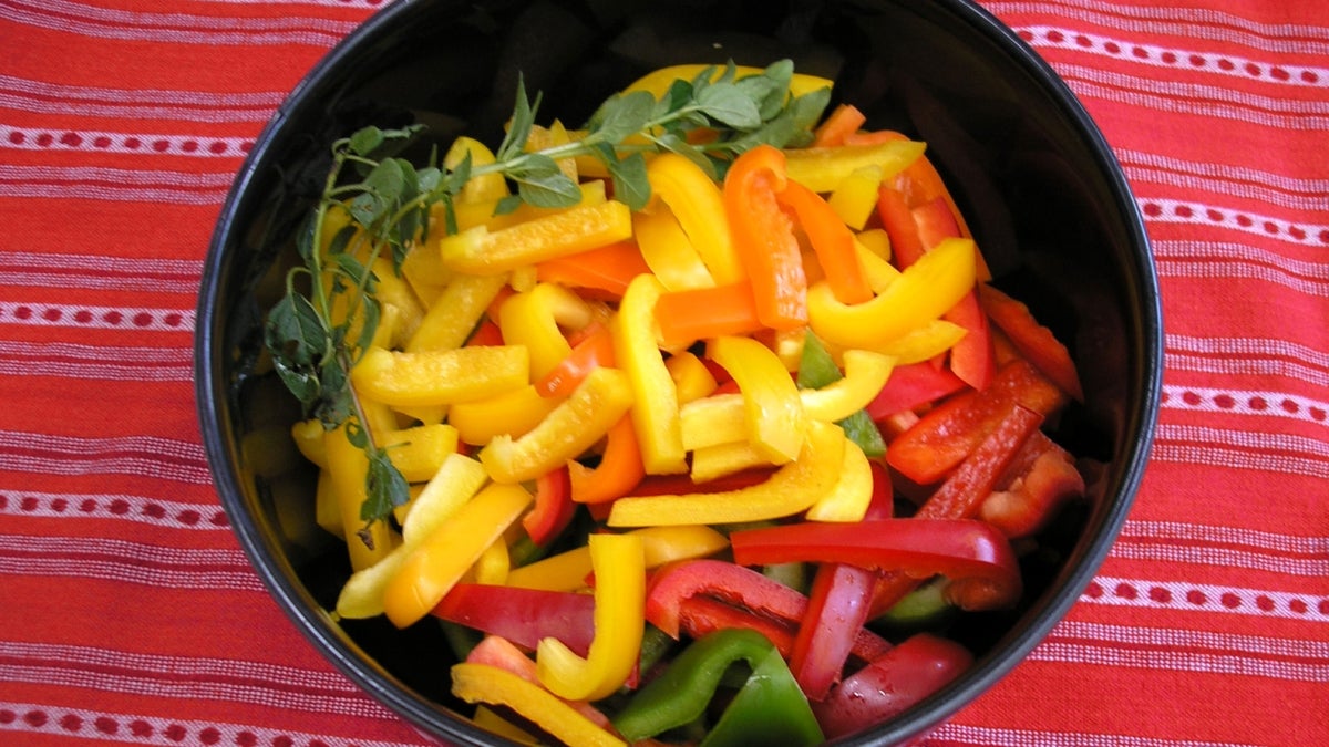 A bowl of sliced peppers.