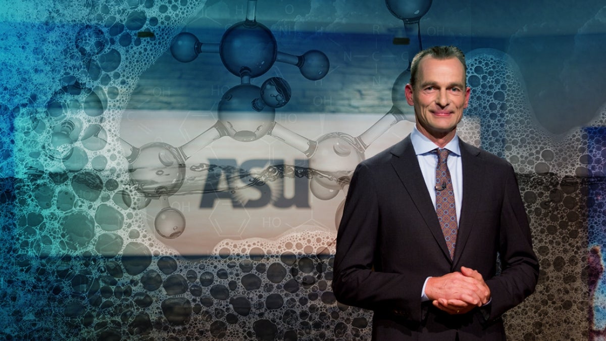 Portrait of man in front of screen depicting soap bubbles