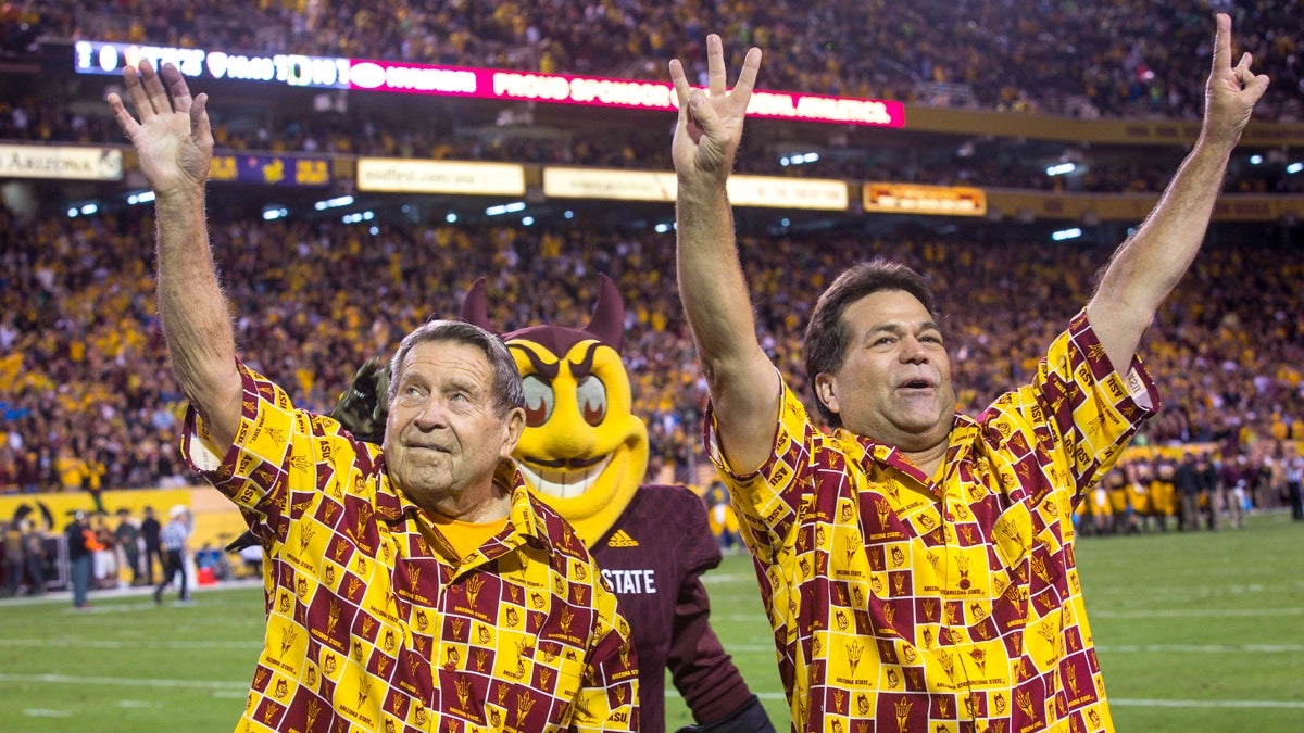 World War II veteran James Agee and his son Jim Agee, a veteran of Operation Desert Storm, at Sun Devil Stadium.