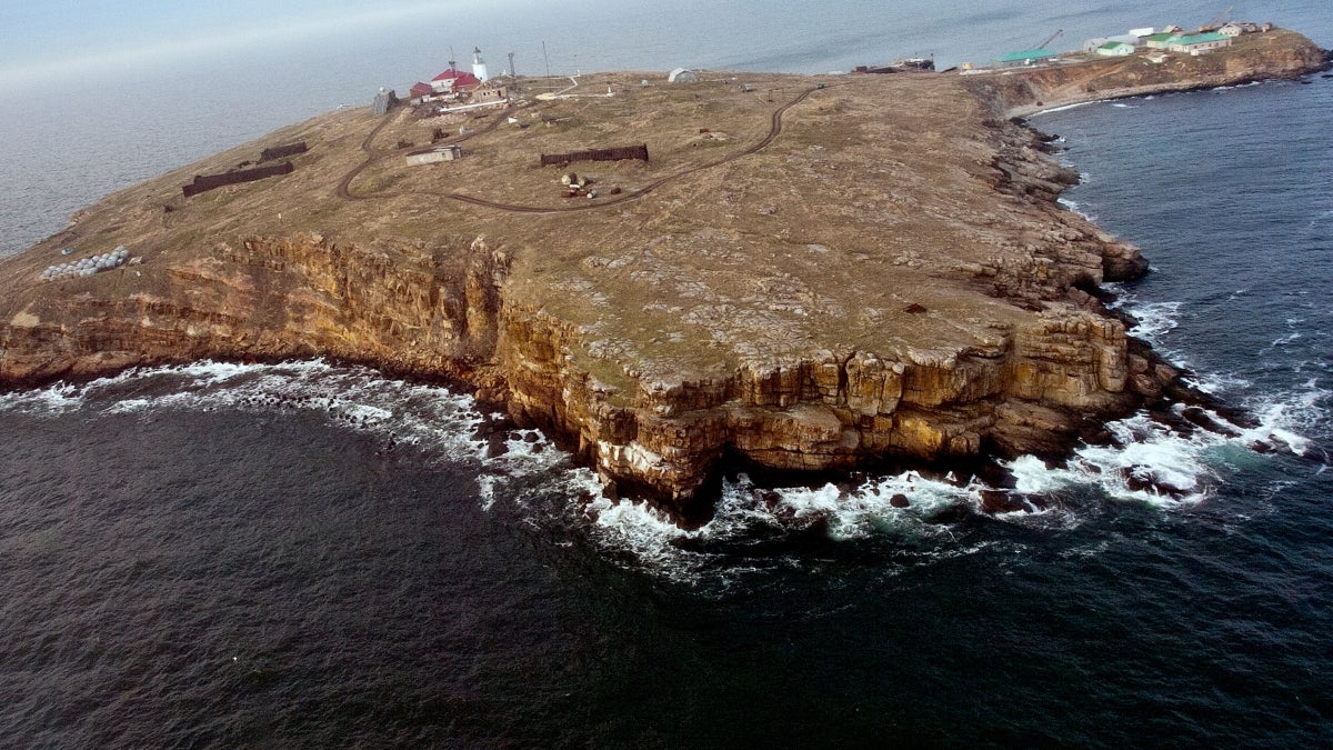 A small island with a few scattered buildings in the Black Sea.