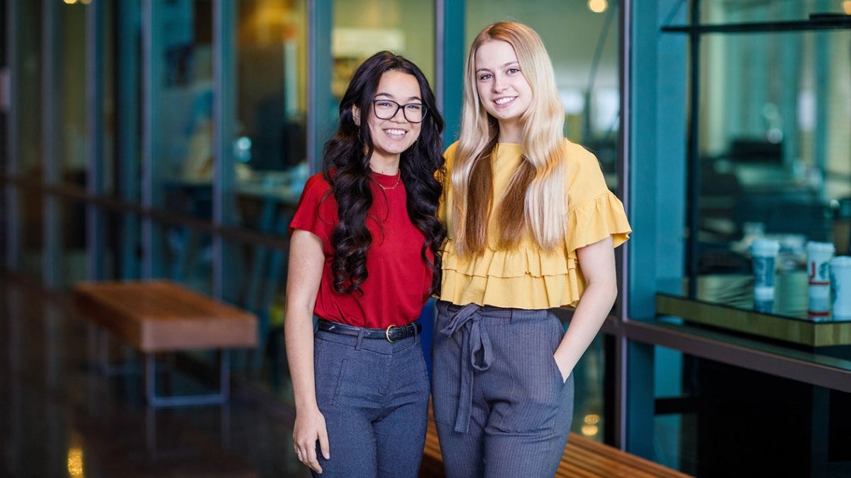 Sylvia Lopez and Brinlee Kidd pose outside of the Luminosity Lab on ASU's Tempe campus