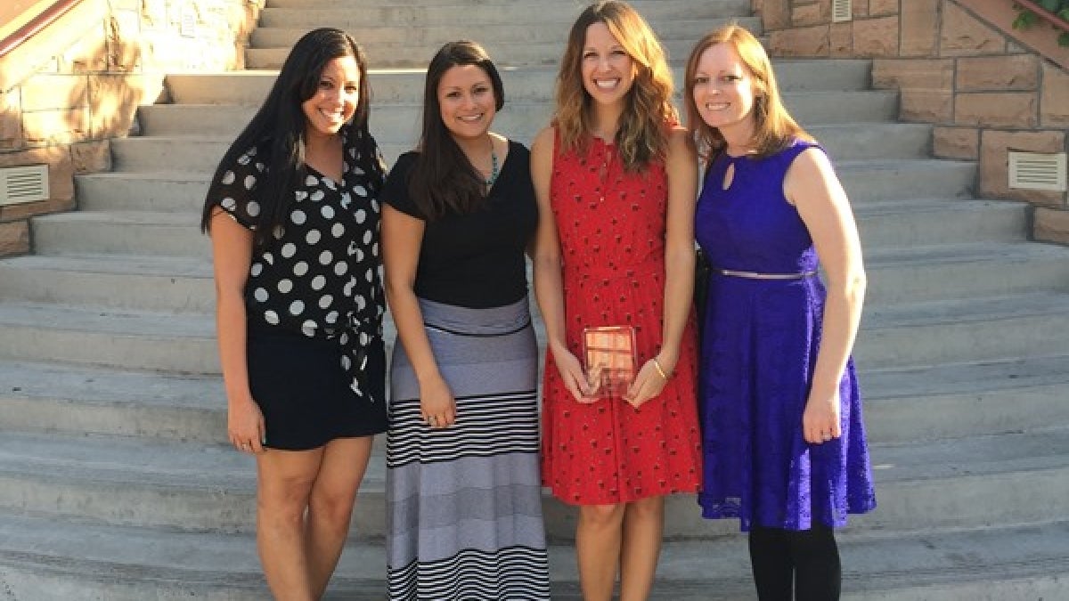 Jillian Turanovic, second from right, with her award