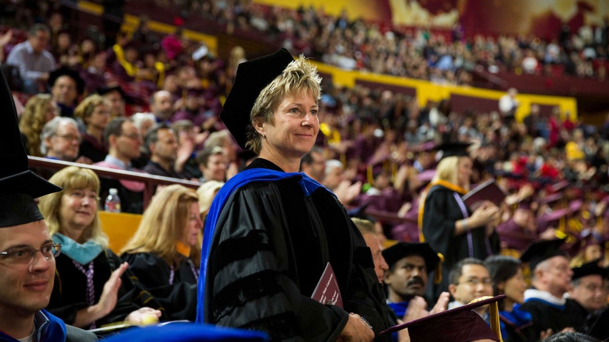 Mary Niemczyk stands at commencement