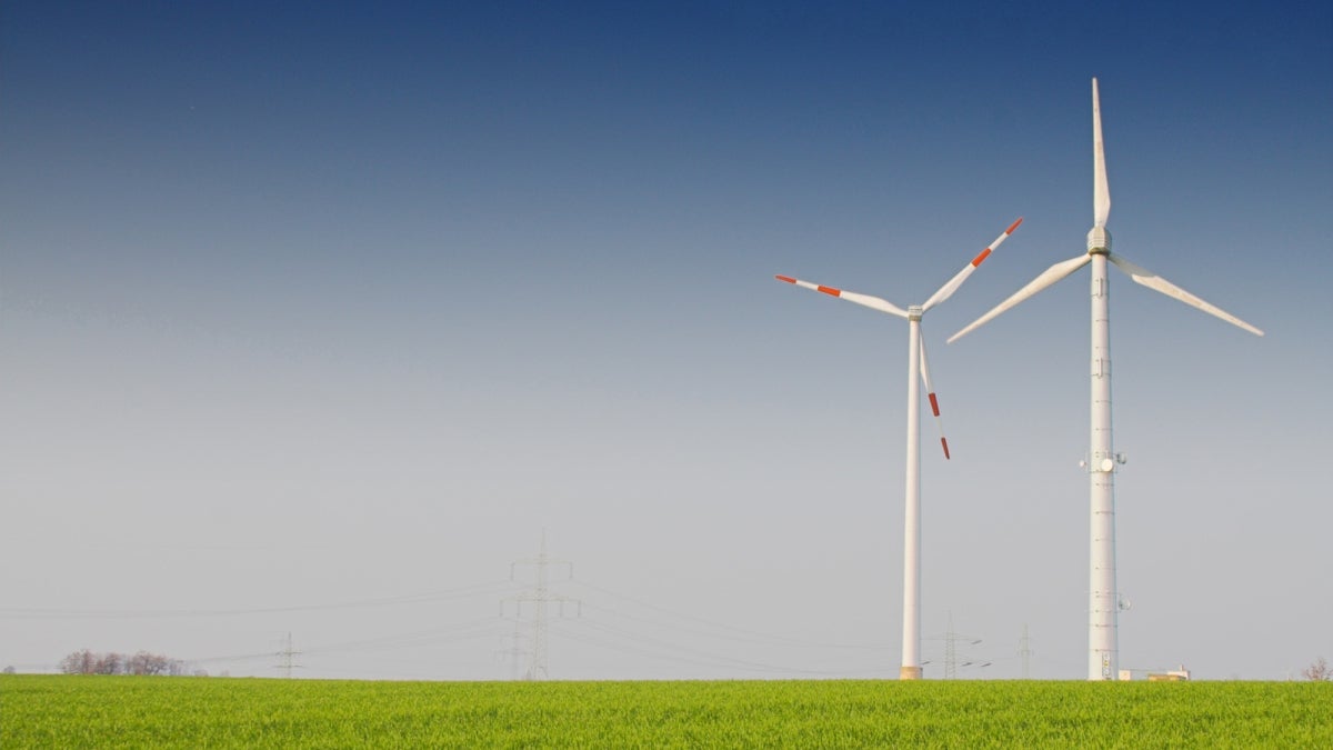 Windmills on a grass meadow