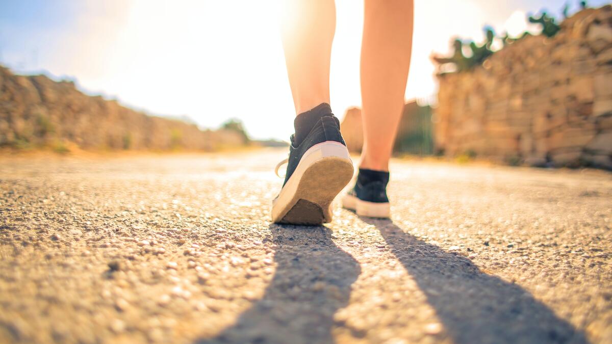 woman walking in the sun