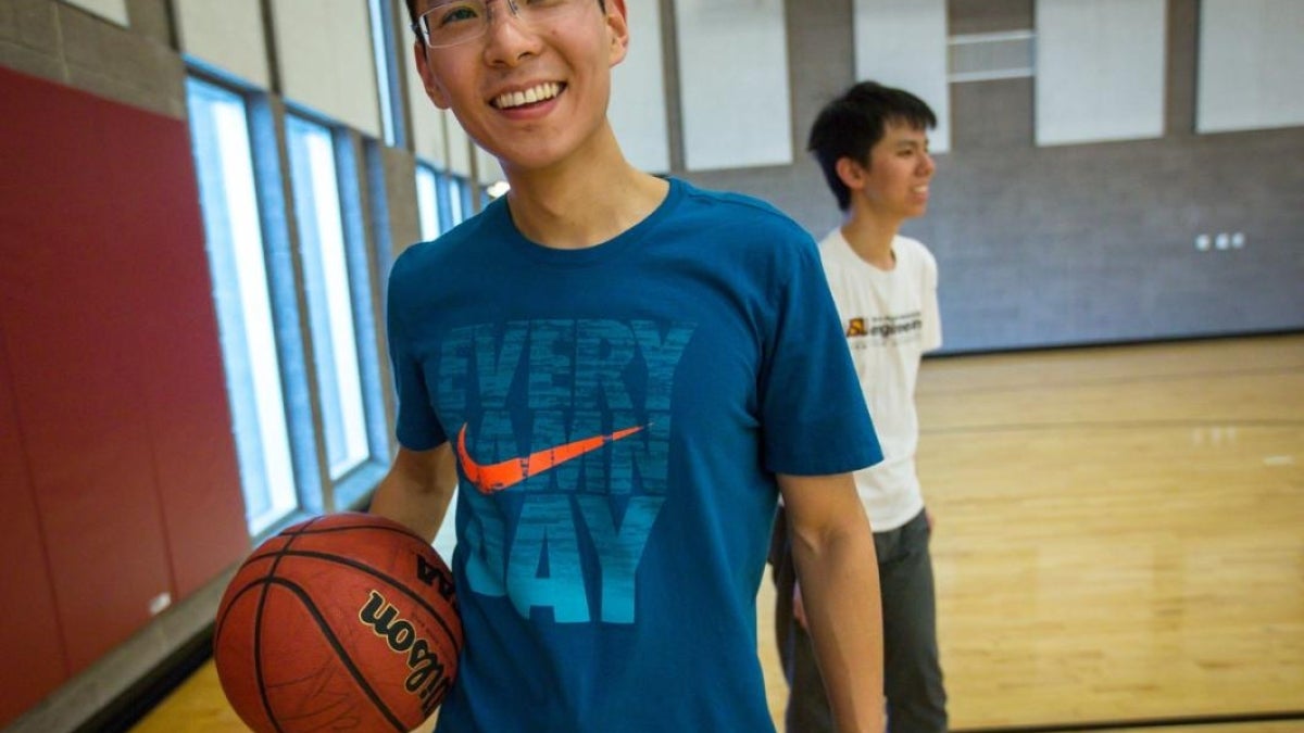 Men playing basketball.