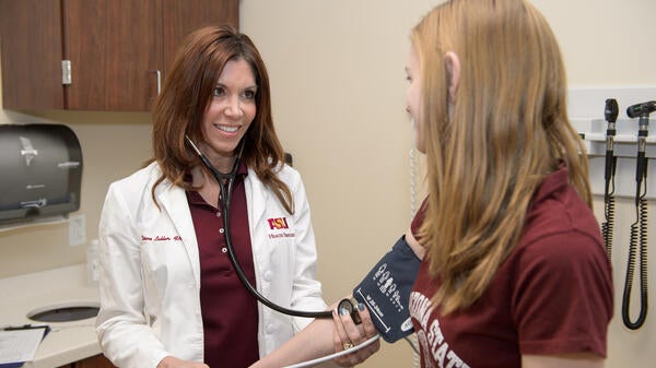 student receiving a physical exam at ASU Health Services