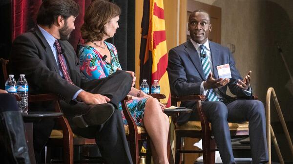 Speakers onstage at the State of Our State conference