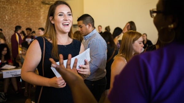 two women talking at career fair