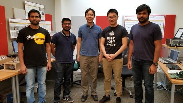 Five people pose for a photo in the ASU Meteor Studio.