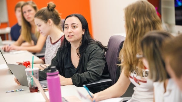 Students on laptops in classroom