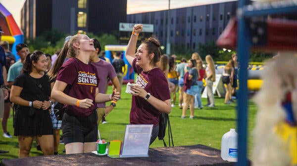 students cheering at Polytechnic campus carnival event