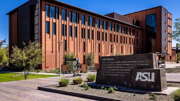 Exterior view of Durham Hall on the Tempe campus with the ASU Charter sign in the foreground.