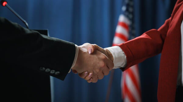 Man and woman shaking hands