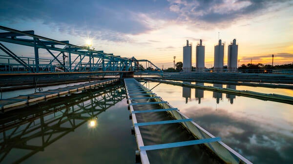 Water treatment plant with sunset in background