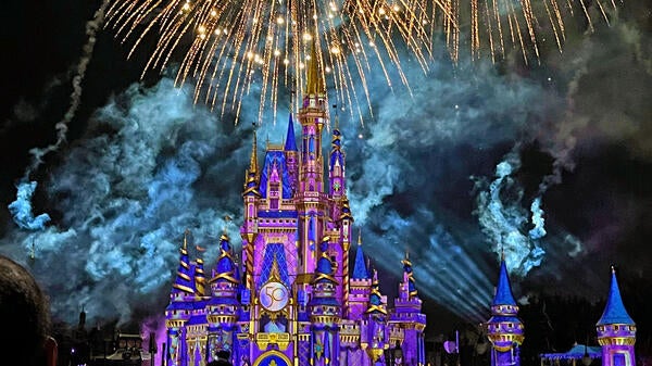 Cinderella Castle at Magic Kingdom with fireworks overhead