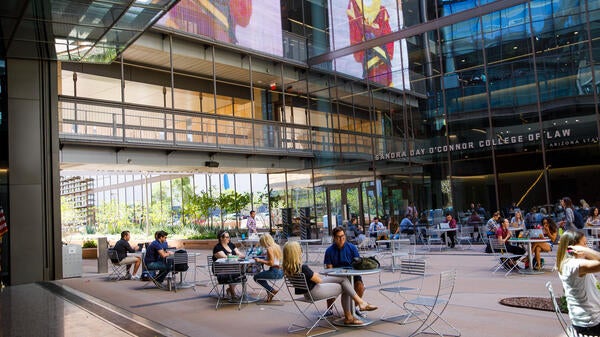 Law students sit outside the Beus Center for Law and Society at Arizona State University. 