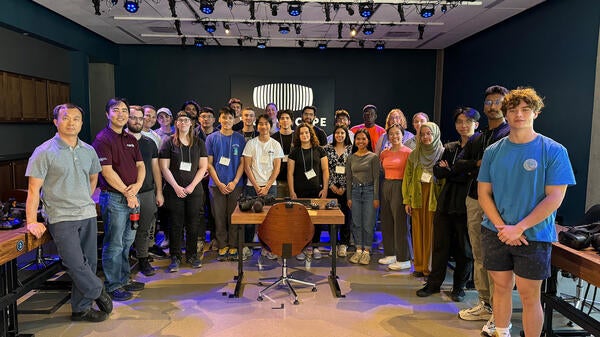 A group of students pose for a photo at an engineering summer camp.