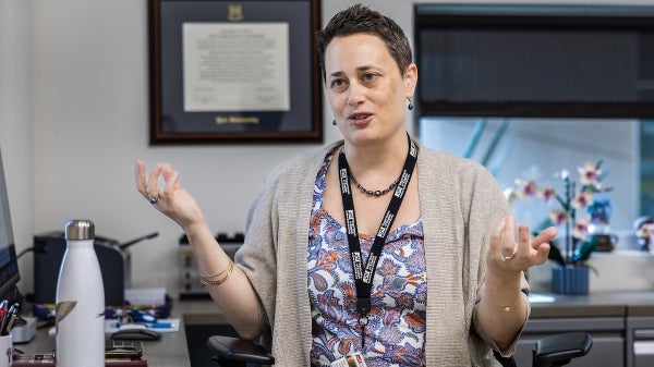 Candid shot of English Department chair Nush Powell in an office