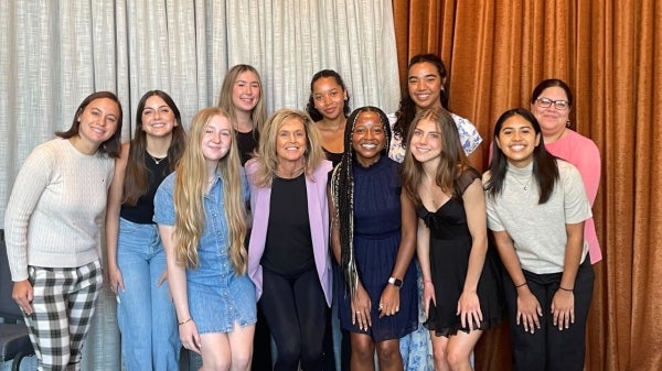 Group of women pose for a photo.