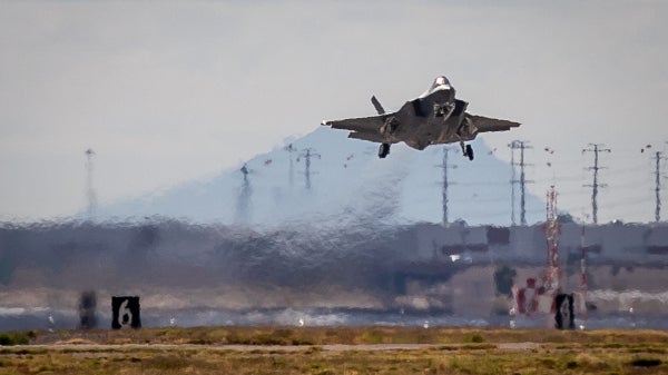 A fighter jet takes off