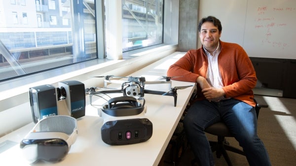 ASU construction engineering and management researcher Ricardo Eiris pictured with virtual reality headsets and related technology.