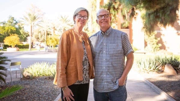 Kathy King and Scott King standing in an outdoor setting smiling