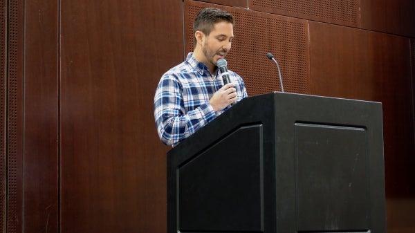 Person speaking at a podium.