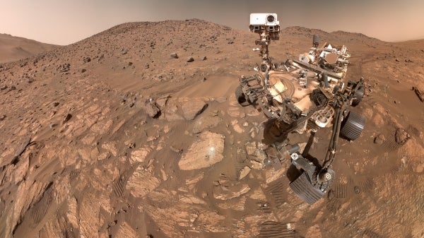 NASA’s Perseverance Mars rover situated on rocky terrain on the planet.