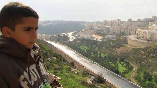 Palestinian filmmaker&#039;s son looks over at Israeli settlements from above