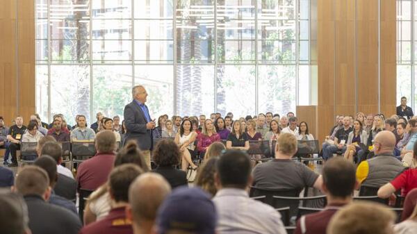 man speaking to audience