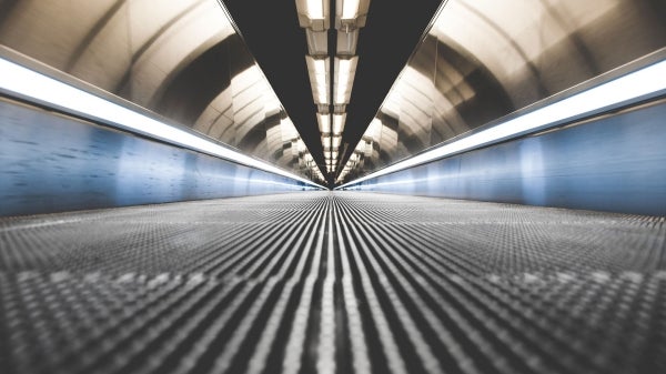 A closeup of an empty moving sidewalk in an airport