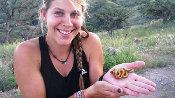 Woman holding a snake