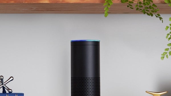 Amazon Echo device on bookshelf