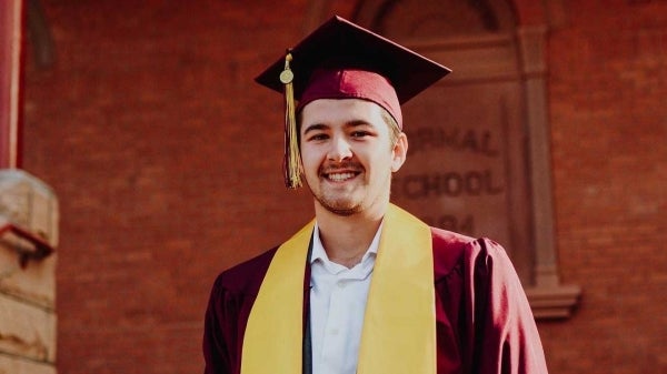 Student's portrait in cap and gown