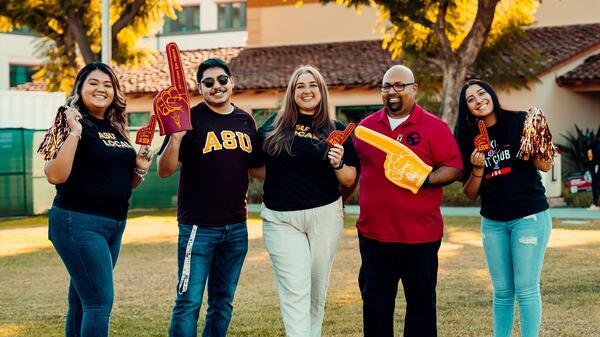 Group of ASU students standing in an outdoor setting.