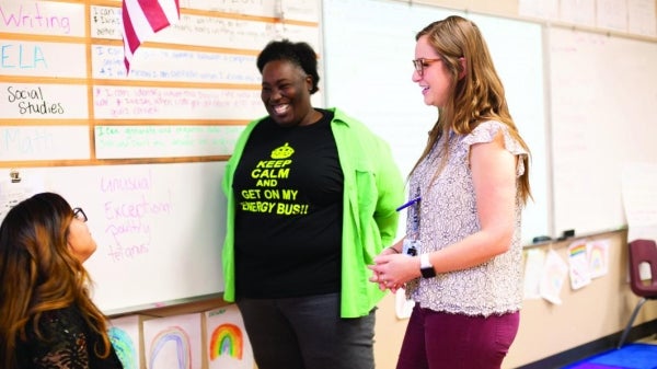 Copper Trails Principal Stacy Ellis, center, oversees efforts to prepare teacher candidates for the classroom.