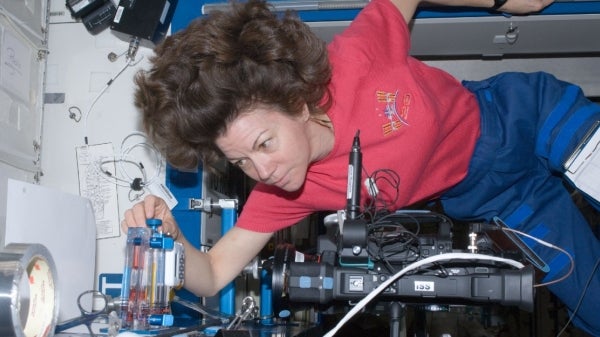 woman floating in a space shuttle