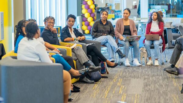 Photo of Black Women in STEM panel and female students who facilitated event